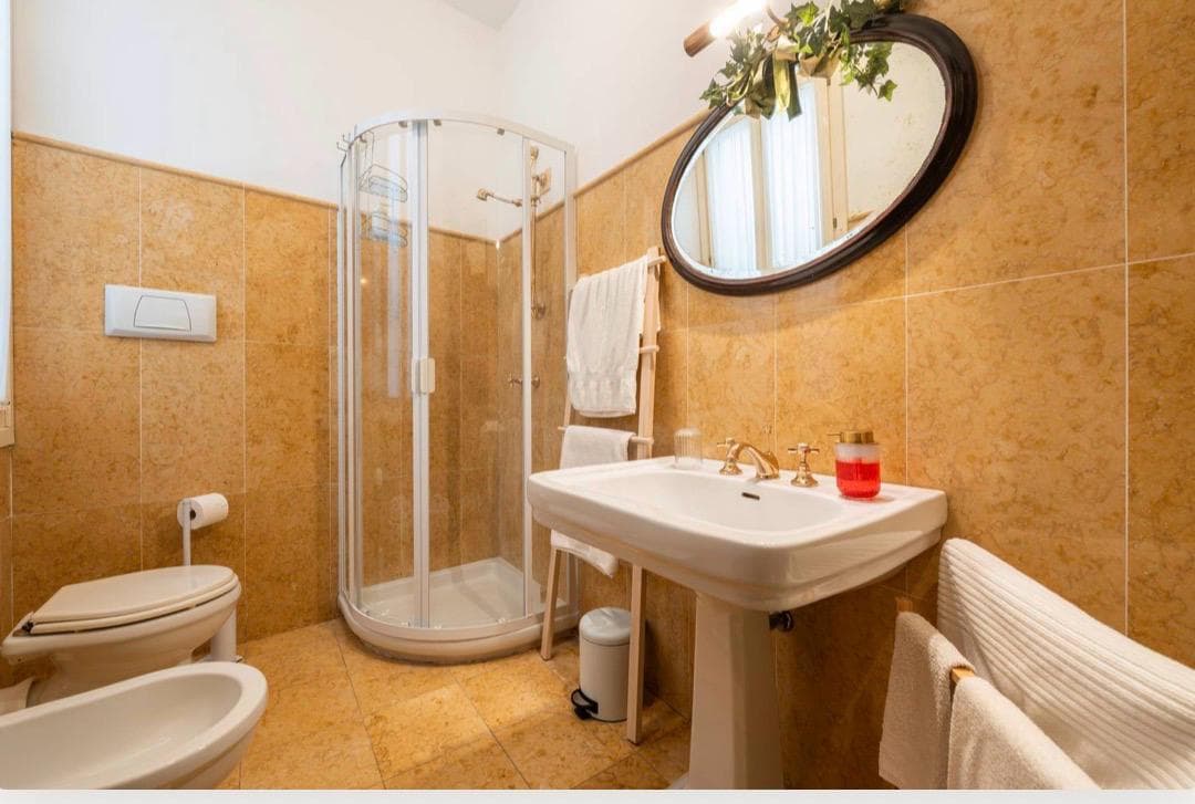 Guest bathroom with shower at ĀMĪTA