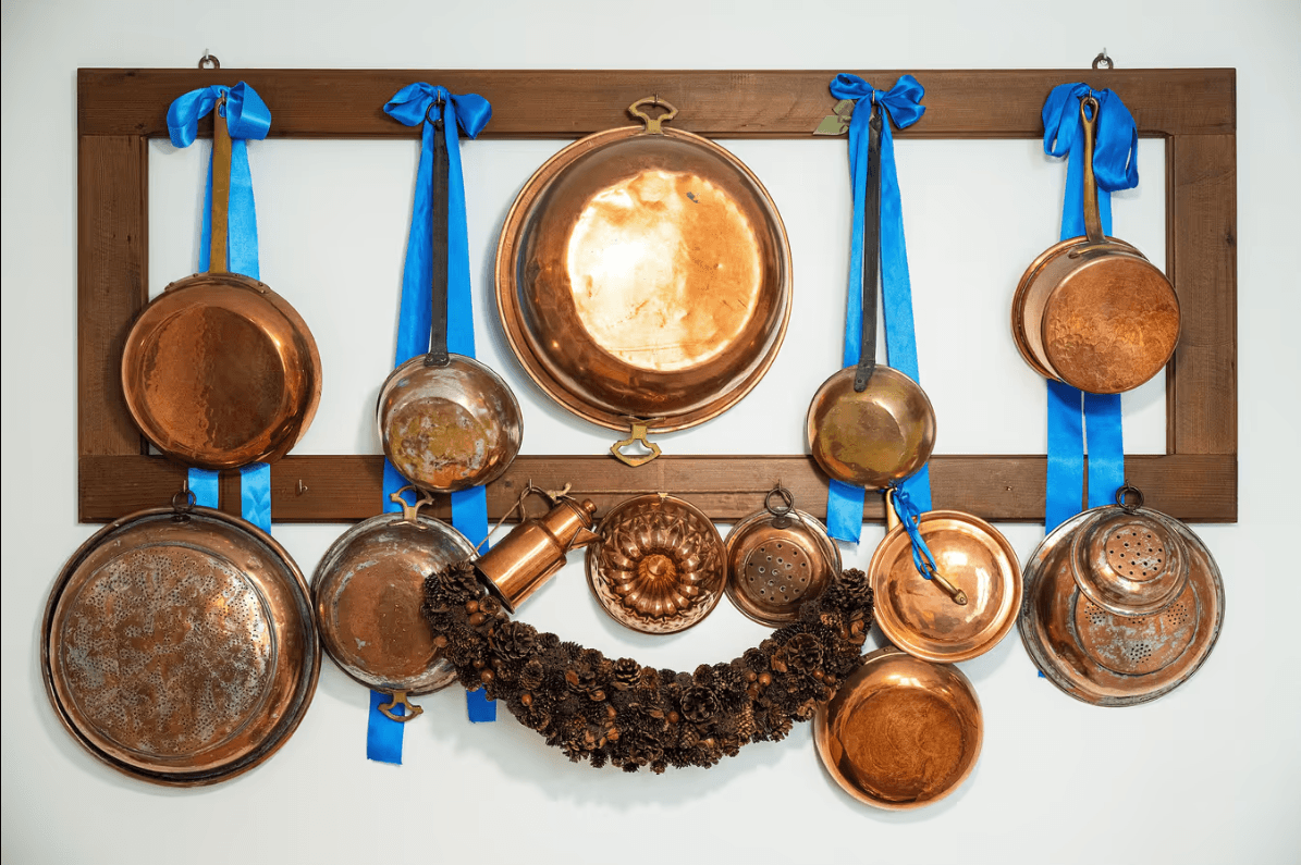 Copper cookware detail in the kitchen at ĀMĪTA